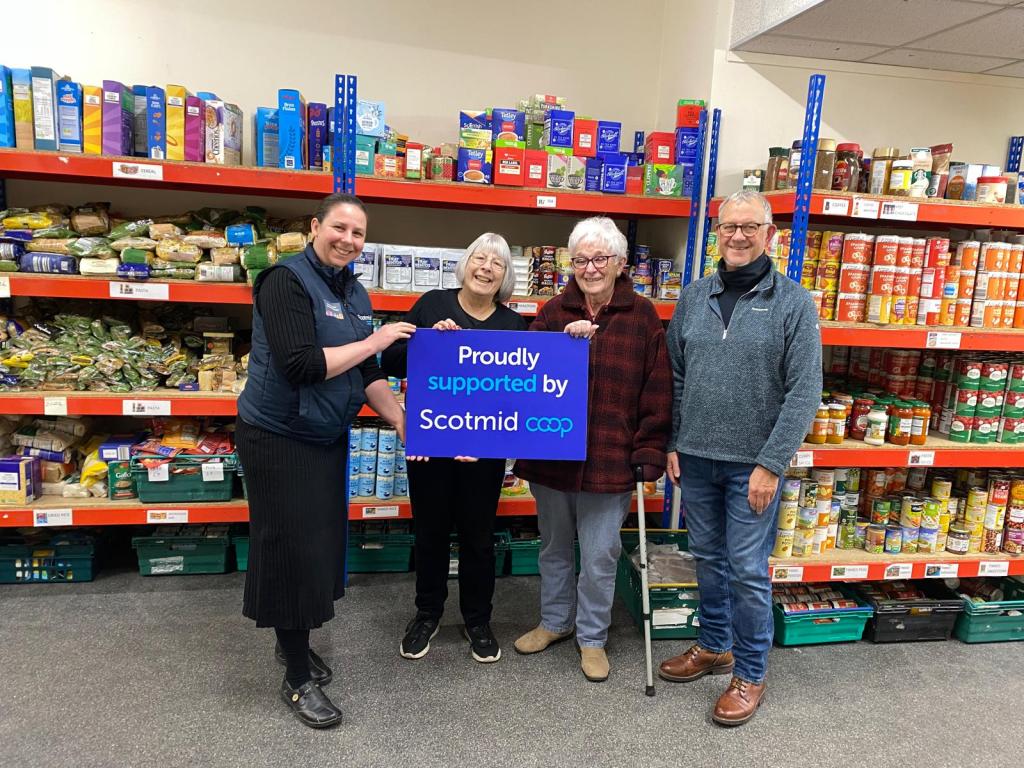Donation from Scotmid featuring volunteers